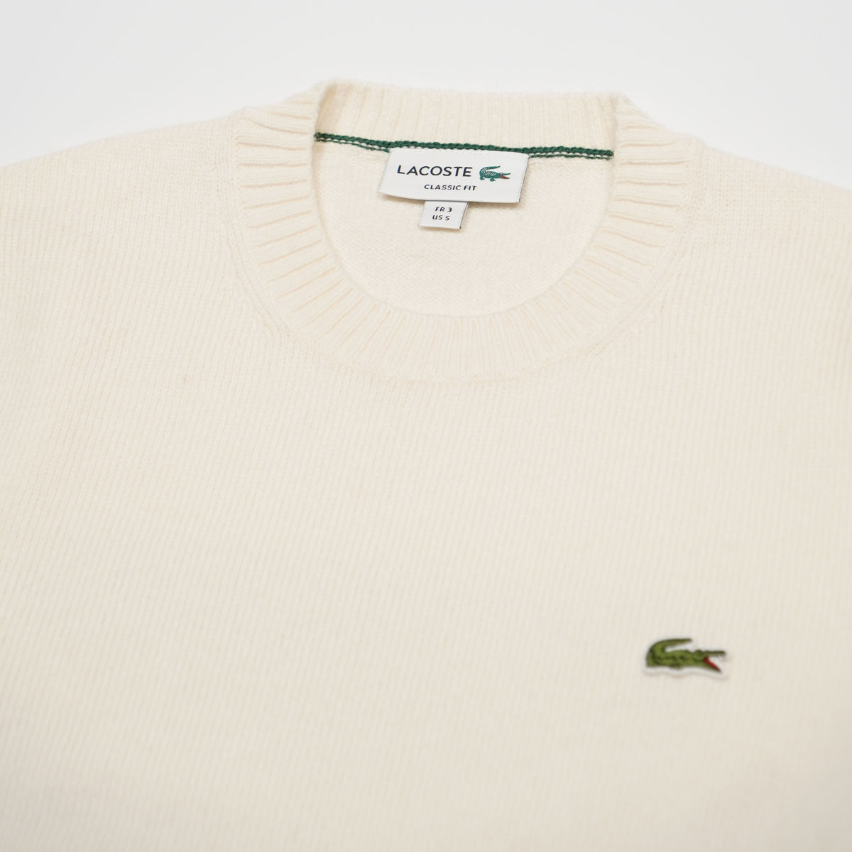 Maglione Girocollo Lacoste AH2916 XFJ Bianco Panna in 100% Lana Cardata Classic Fit con Coccodrillo Ricamato